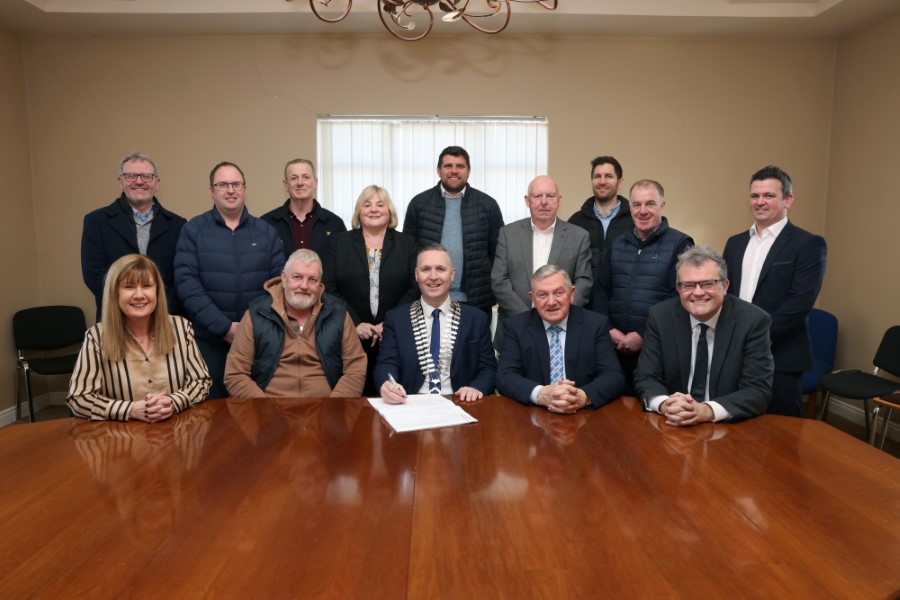 Pictured signing contracts for the provision of 33 turnkey social homes at Lisaturrin in Kingscourt are (back row left to right) John Wilson, Senior Engineer Housing Construction; Martin Gormley, Wynne, Gormley, Gilsenan Architects; Anthony Naughton, Clerk of Works; Cllr Carmel Brady; Paul Brady, Wynne Gormley Gilsenan; Cllr Paddy McDonald; Tommy Reilly, Project Manager, Cavan County Council; Cllr Val Smith; Cormac Fitzpatrick, Cavan County Council Housing Construction. Front: Lynda McGavigan, A/Director of Service; Sean O’Hagan, Darra Bridge Housing; Cathaoirleach, Cllr Philip Brady; Cllr Clifford Kelly; Eoin Doyle, Chief Executive, Cavan County Council. PHOTO: Adrian Donohoe