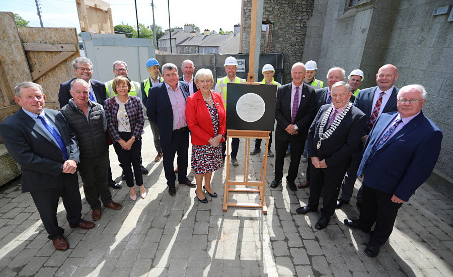 Minister for Rural and Community Development, Heather Humphreys TD and Cathaoirleach of Cavan County Council, Cllr Clifford Kelly are joined by Oireachtas members, councillors, council management and staff, and project contractors unveiling a plaque at a ‘Topping Out’ ceremony for the new Virginia Civic, Cultural, and Library Services Centre PHOTO: Lorraine Teevan