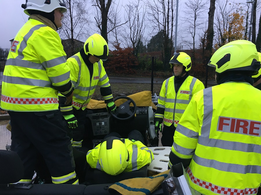 Recruits take part in a patient extrication at a simulated road traffic collision